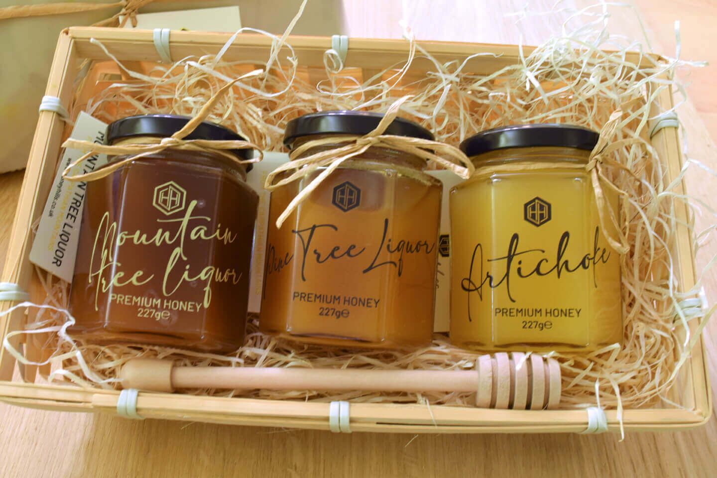 3Mountain01 - Honey Hills - Online artisan shop with delicious, rare raw mountain honey varieties Gift basket with three jars of premium honey: Mountain Free Liquor, Pine Tree Liquor, and Artichoke. Each jar is 227g.